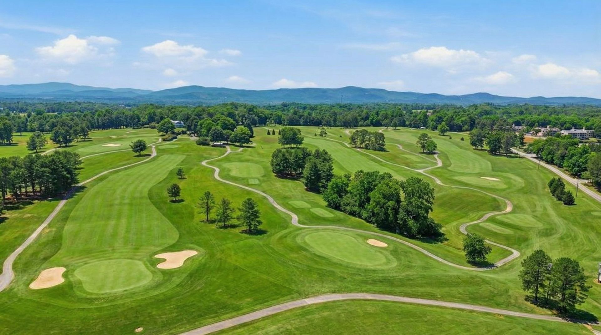 Panoramic view of Apple Mountain Golf Course fairway with mountain backdrop